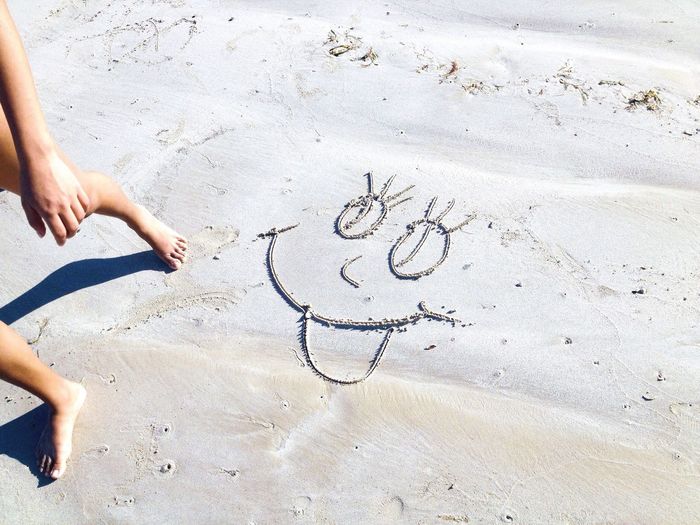 Drawing on sand at beach