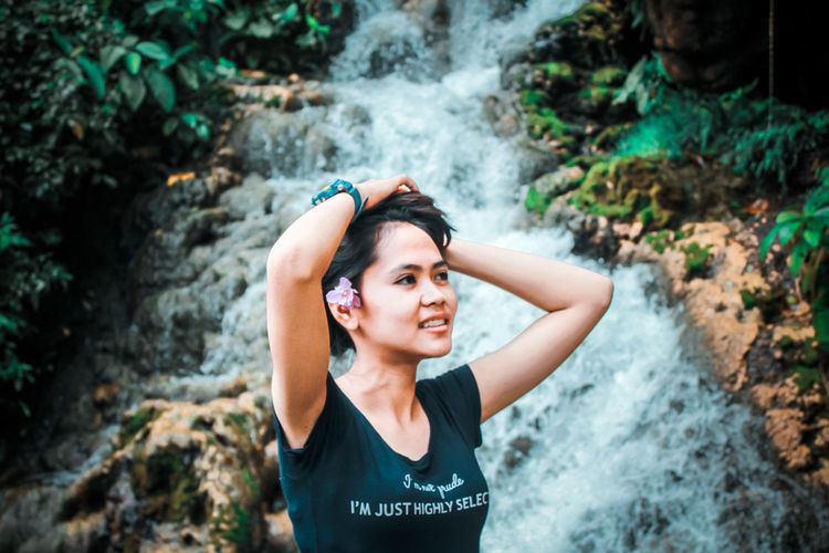 Portrait of beautiful young woman in forest