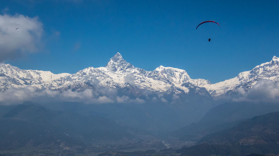 Paragliding over himalaya mountains, pokhara nepal