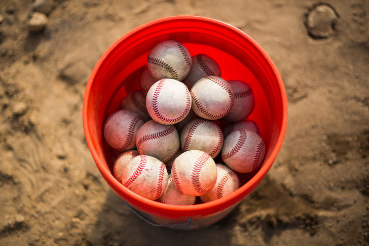 Balls in bucket on field