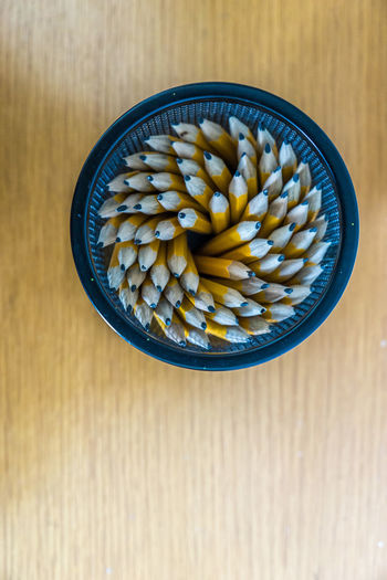 Overhead view of pencils in bowl