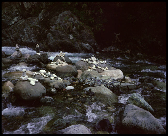 Rocks in river during winter