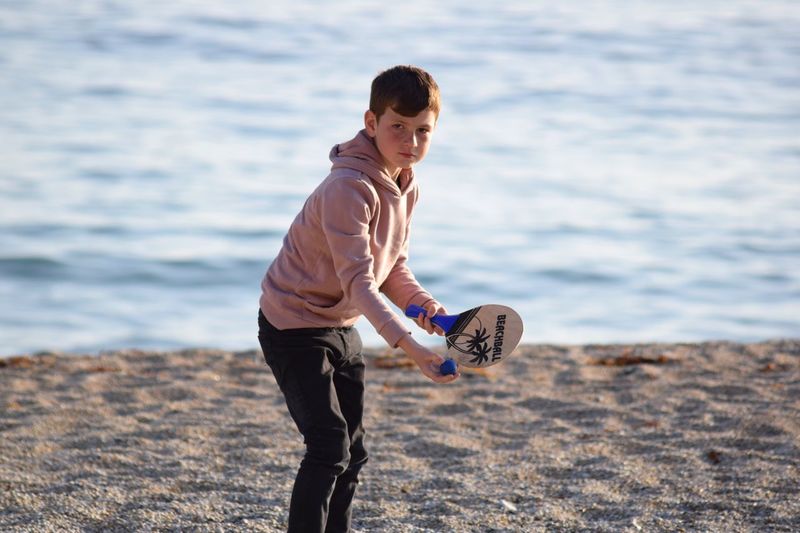 Boy playing at beach