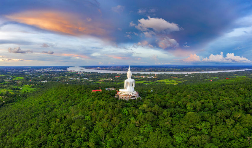 Top view aerial photo from flying drone. big buddha wat phu manorom mukdahan province, thailand.