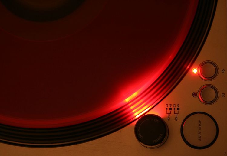 Illuminated gramophone in darkroom at night