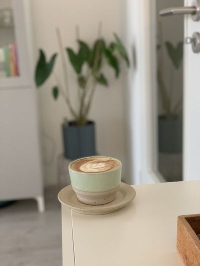 Close-up of coffee cup on table