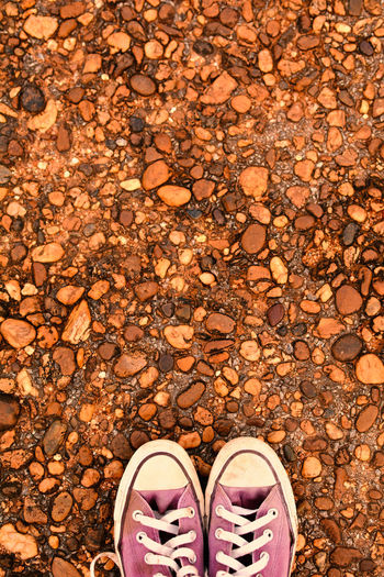 Directly above shot of shoes on stones