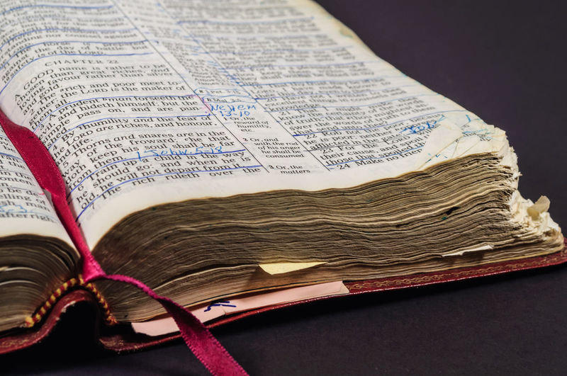 Close-up of bible against black background