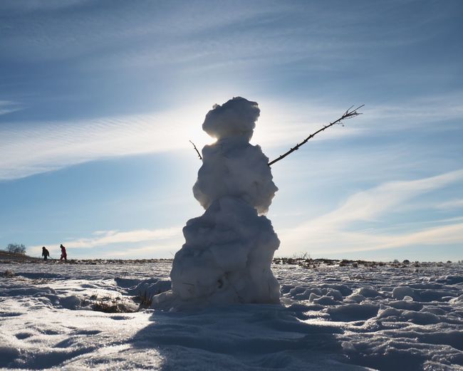 Natural icy snowman. the snow cover the landscape. winter time scene.