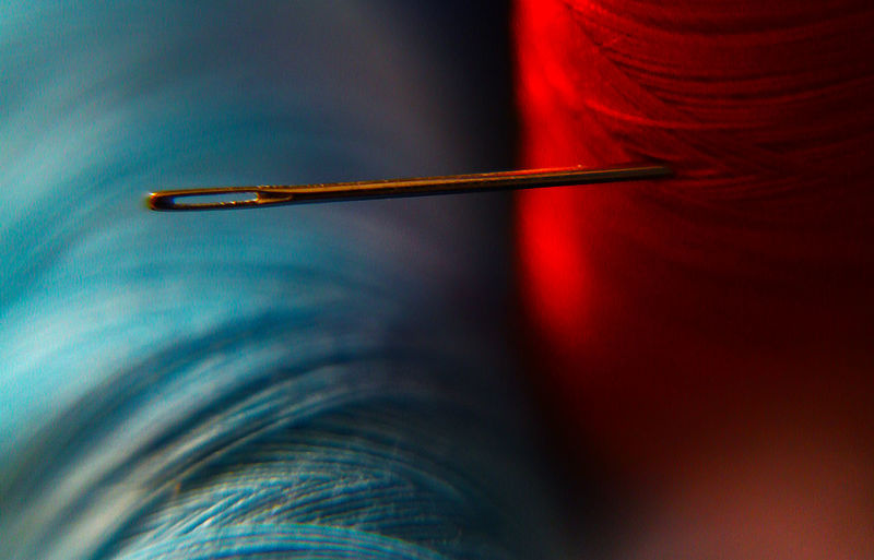 Extreme close-up of spool with needle