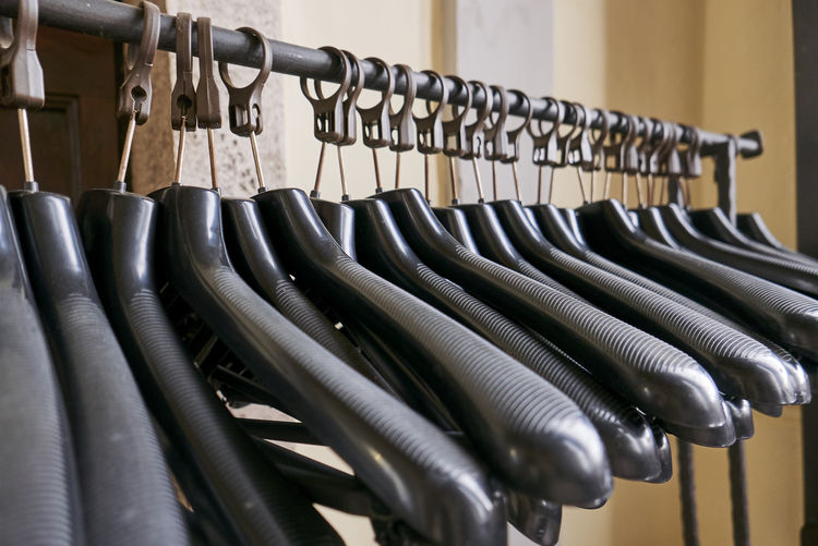 Close-up of piano hanging in rack