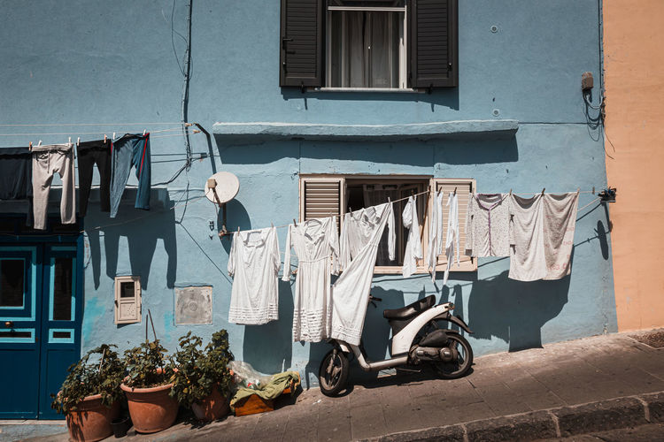 Clothes drying on clothesline against house