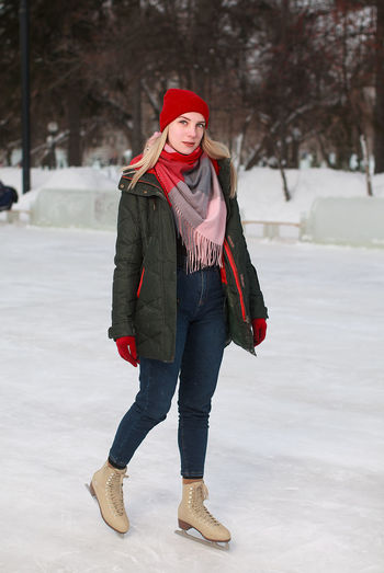 Beautiful girl standing at the rink
