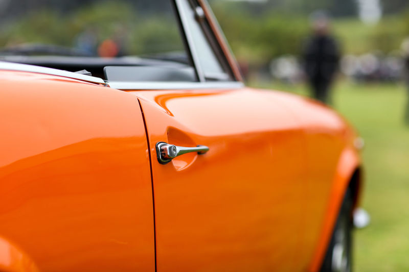 Close-up of orange vintage car