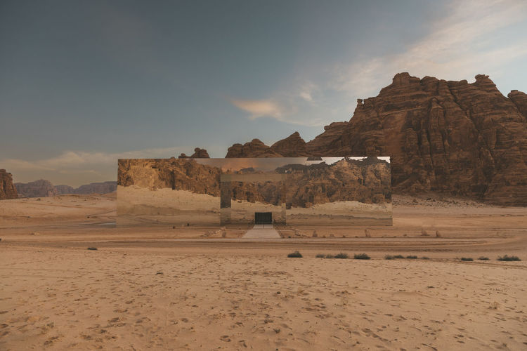 Built structure on desert against sky