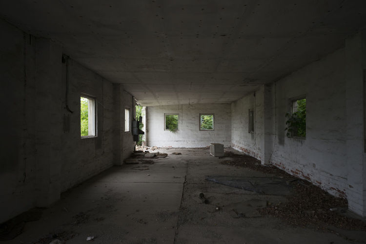 Abandoned interior with white walls