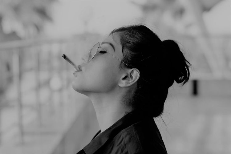 Woman smoking marijuana joint