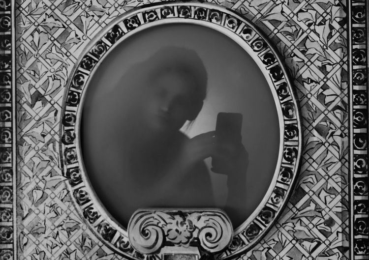 Reflection of woman in mirror