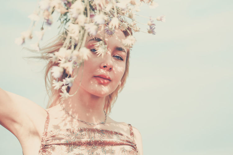 Beautiful fashion model girl with floral wreath. harmony natural concept concept