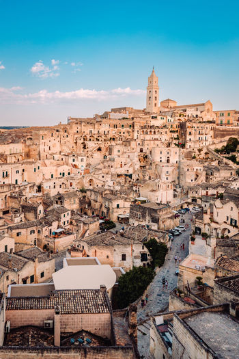 View of the sassi di matera from the belvedere di san pietro barisano, blue sky with clouds