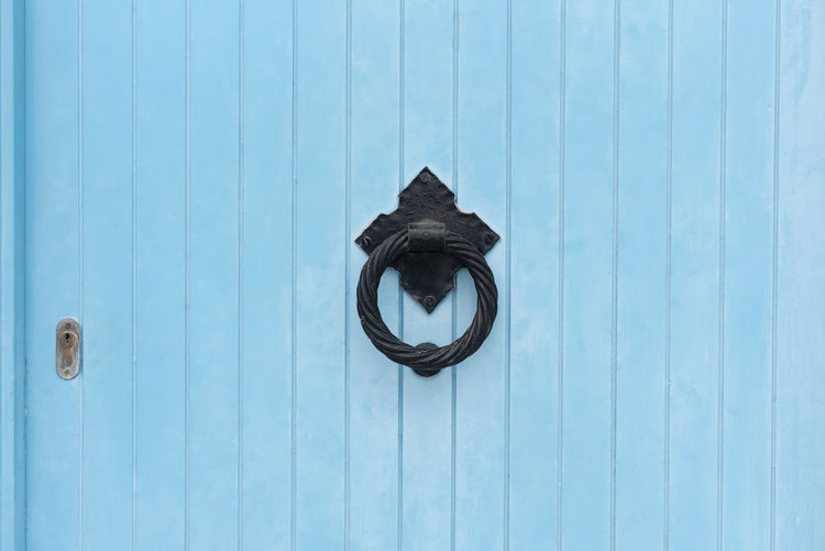 Blue door with old knocker