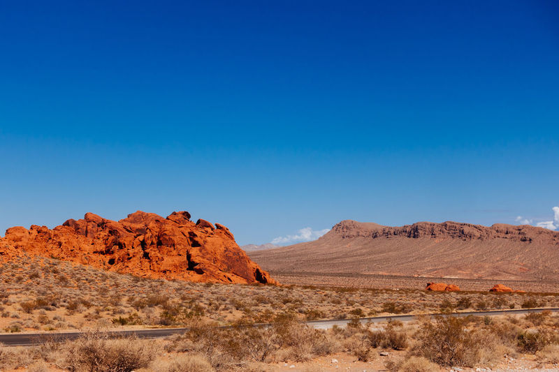 Rock formation on field against clear sky at valley of fire state park