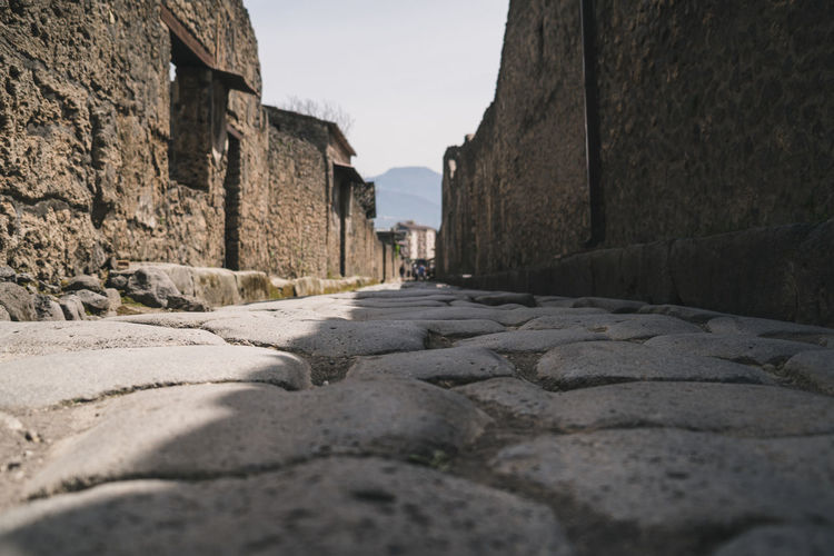 Low angle view of an ancient roman road in pompeii