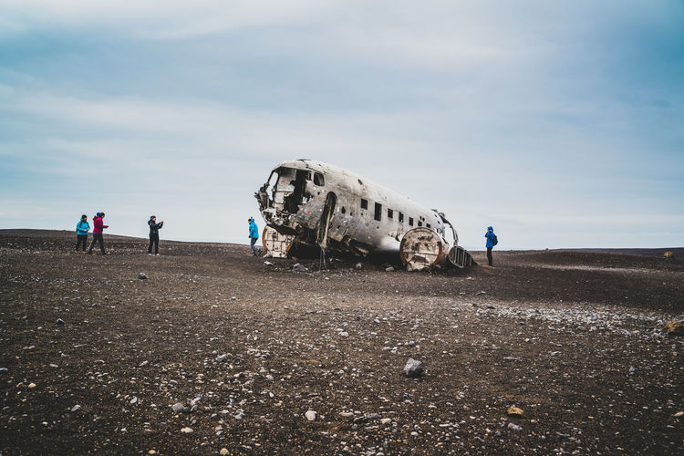 Group of people on abandoned airplane