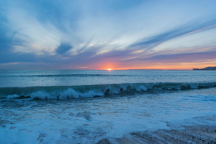 Scenic view of sea against sky during sunset