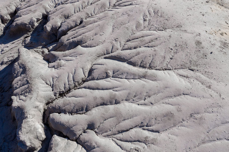 Aerial shot of abandoned opencast mine. abstract cracked mud pattern, erosion, bad land from a drone
