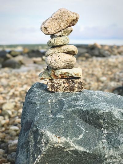 Close-up of stack of pebbles on beach