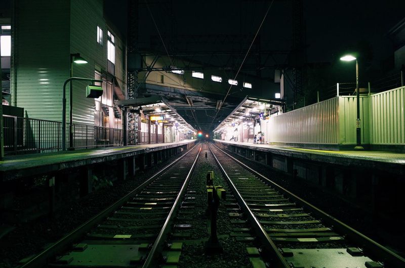 Railroad station platform at night