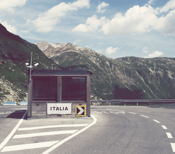 Empty road with mountains in background