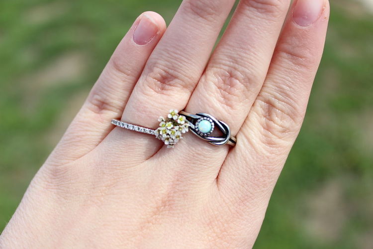 Close-up of person hand holding ring