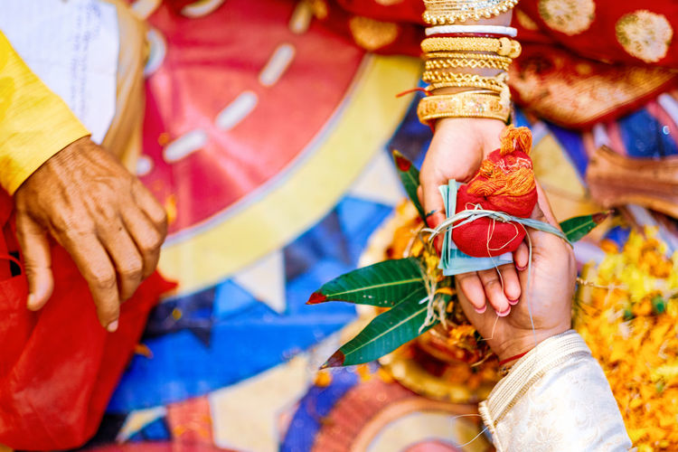 Close-up of bride and groom getting married