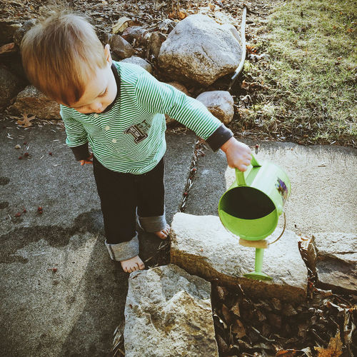 Child watering plants