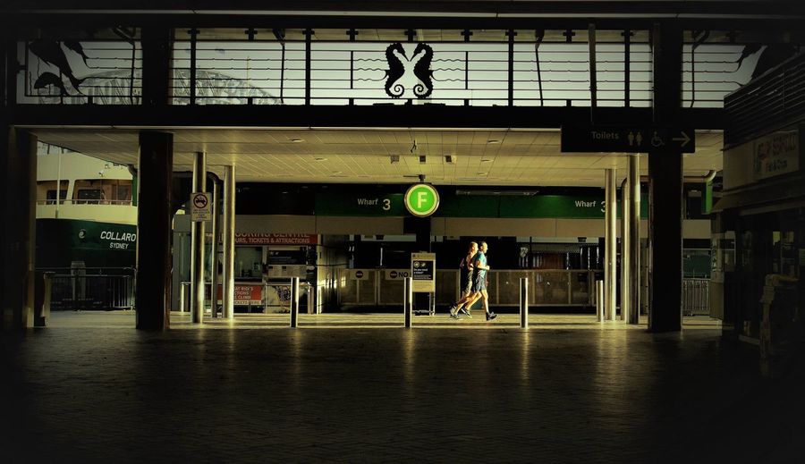 Man waiting at railroad station platform
