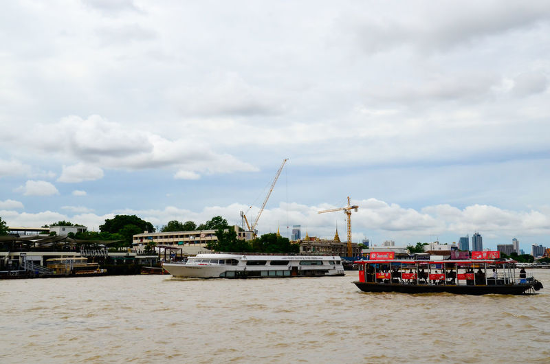 Boats moored on chao phraya river