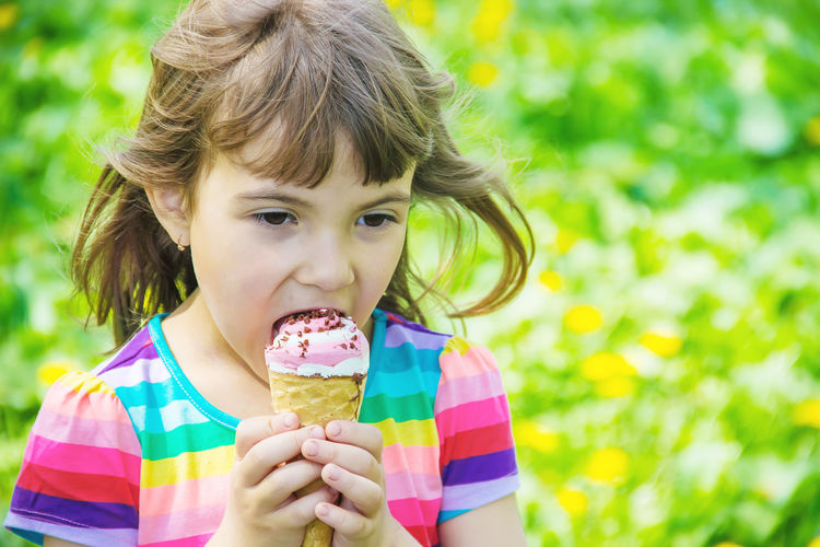 Close-up of girl eating ice cream cone