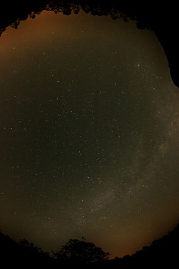Scenic view of landscape against sky at night