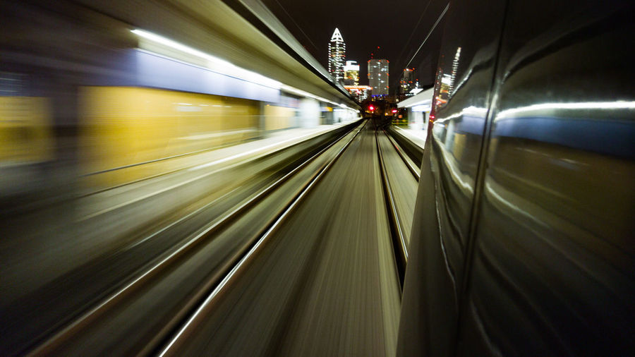 Blurred motion of train at railroad tracks