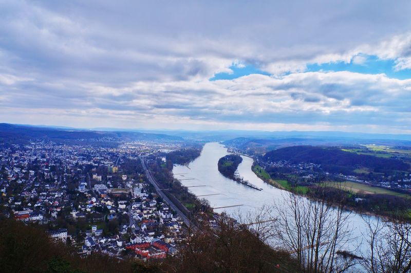 Aerial view of river and cityscape against sky
