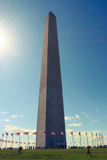 Low angle view of washington monument against blue sky