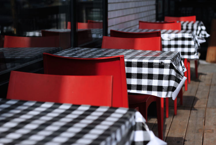 Empty chairs and tables in cafe
