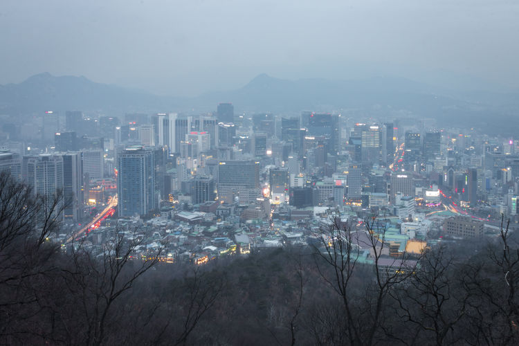 High angle view of seoul cityscape against sky in winter 