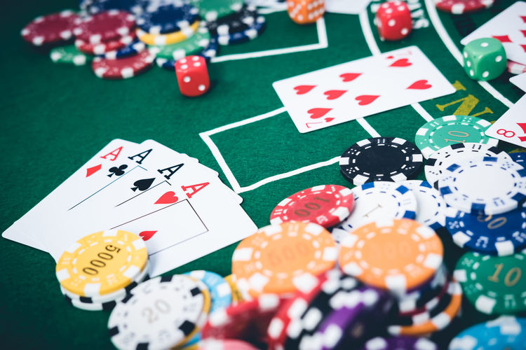 High angle view of gambling chips and cards on table