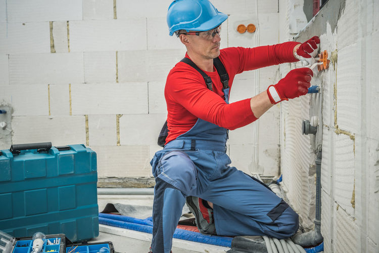 Rear view of man working at construction site