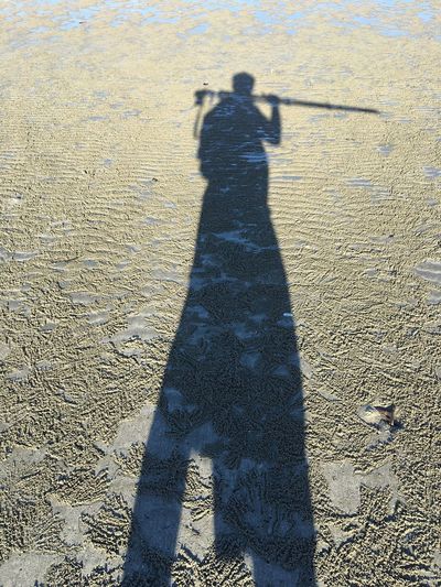 Shadow of people on sand