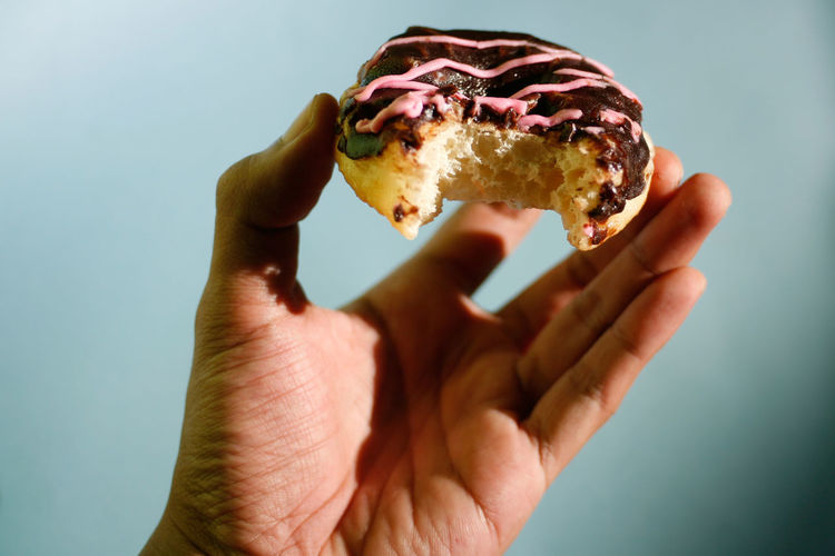 Close-up of hand holding food