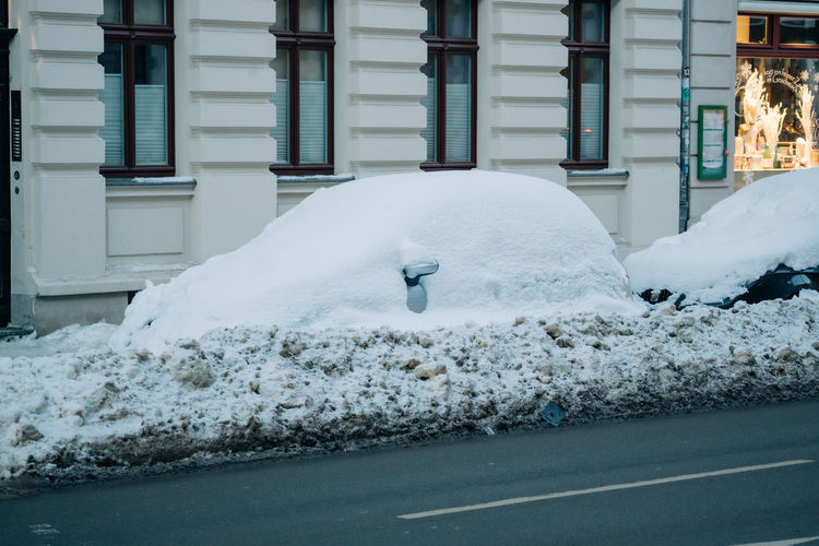 Car completely covered in snow